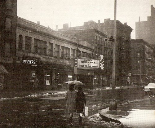 Street scene: Movie theater, snow, rain, promise